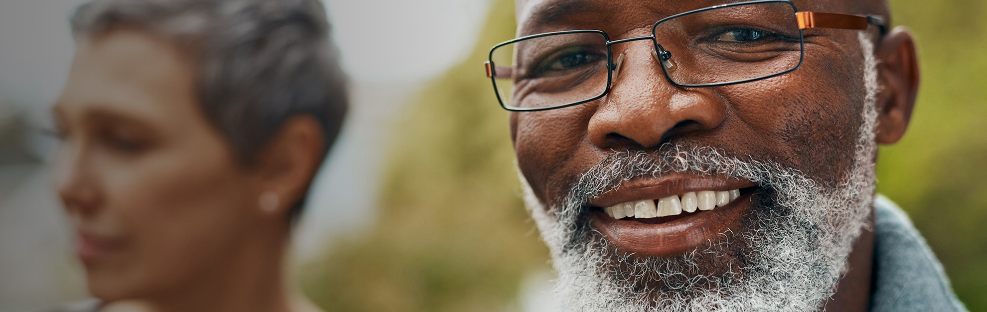 Close up of man smiling.