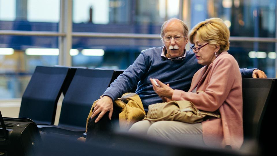 Husband and wife in airport.